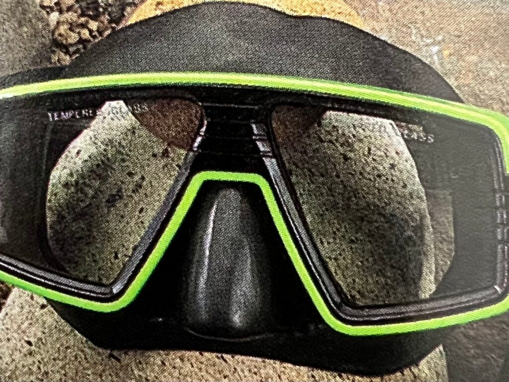 Black diving mask with a lime green frame