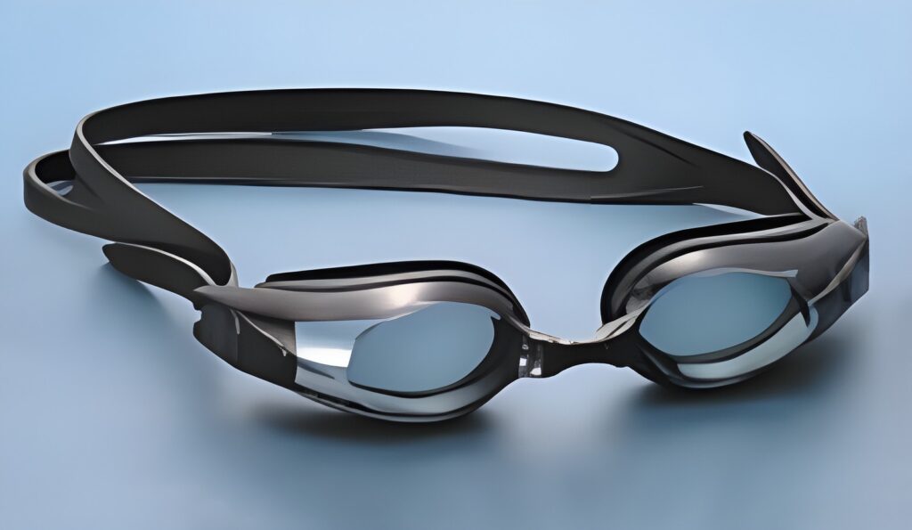 Swimming goggles with gray strap and smoke lenses
