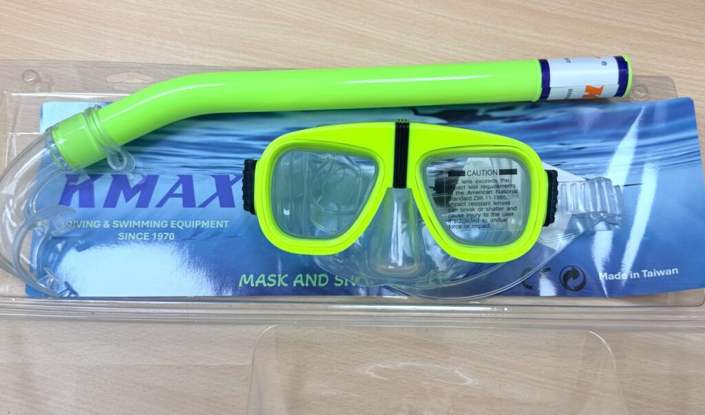 Lime green KMAX mask and snorkel set in retail packaging